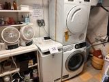 a washer and dryer in a small room