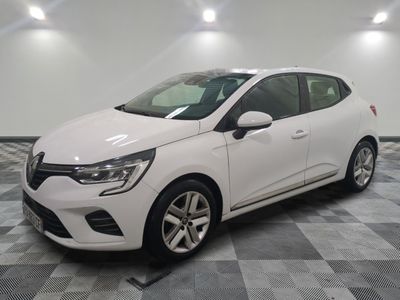 the white car is parked on a checkered tile floor