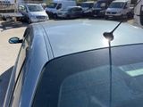 many cars parked in a parking lot next to each other