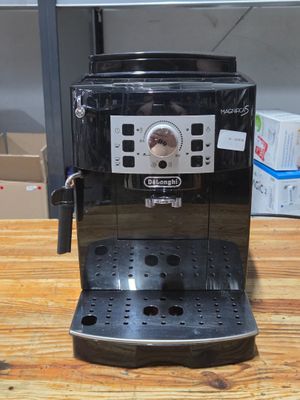a coffee machine that is sitting on a wooden table