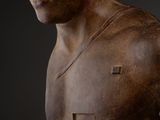 statue of a man with no shirt on and no shirt on