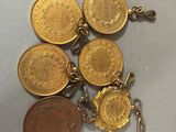 a close up of a bunch of coins on a table