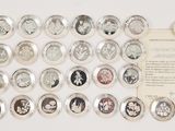 an image of a collection of coins and a card with a picture of a woman