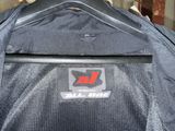 a jacket hanging on a hanger in a garage
