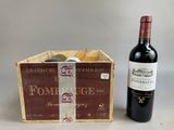 une bouteille de vin à côté d'un carton de vin