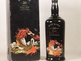 an image of a bottle of whisky sitting next to a box
