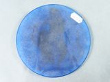 a blue plate with a tag on it on a table
