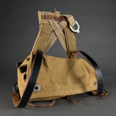 an image of a brown bag with a black strap