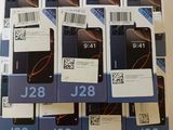 several boxes of cell phones are stacked on top of each other
