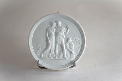an image of a white plate with a picture of a man and a woman on it