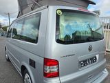 a silver van that is parked in the parking lot