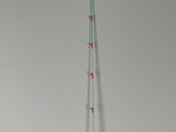 a tall pole that is standing up against a wall