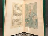 an open book with a picture of a woman and a dog on it