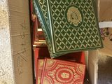 a cardboard box with books in it on the floor