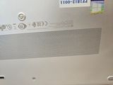 a close up of a laptop with a sticker on it