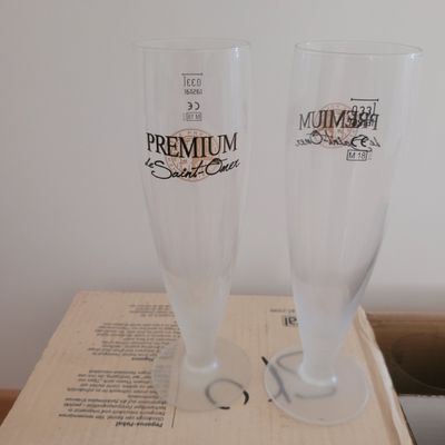 two glasses sitting on top of a box on a table