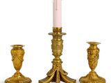 three candles that are sitting next to each other