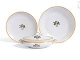 two plates and a bowl on a white surface with a yellow border
