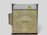an image of a gold mailbox with a glass top