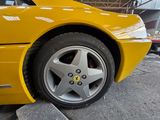 a yellow sports car parked in a garage
