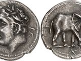 an image of a silver coin with an image of an elephant on it