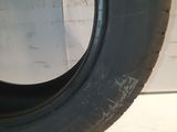 a close up of a tire on a white surface