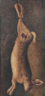 tableau représentant un lapin suspendu à une ficelle accrochée au mur