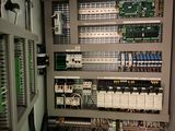 a large electrical panel with many wires and switches