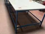 a long table that is sitting in the middle of a room