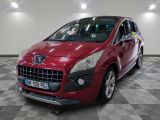 a picture of a red car that is parked in a garage