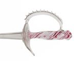 a close up of a knife with a ring on it