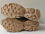 a close up of a pair of shoes on a white surface