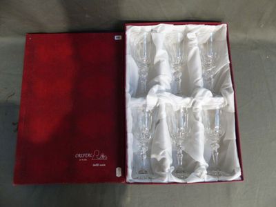 boxed wine glasses in a red box on a table