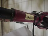 a close up of a hair dryer on a bathroom wall