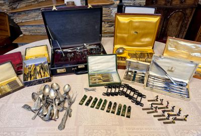 a table with a lot of silverware on it