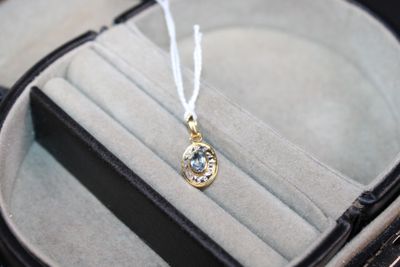 a necklace that is sitting in a case on a table