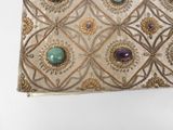 an image of a purse with stones on it