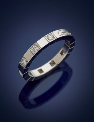 a white gold ring with diamonds on a blue background