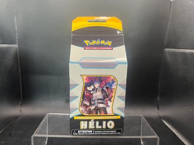 display case for a pokemon card game with a box of cards