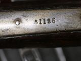 an image of a close up of a metal object with a number on it