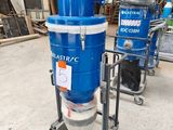 a blue machine that is sitting on a cart