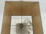 a small square box with a wire attached to it