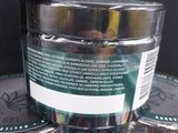 a jar of gel sitting on top of a stack of jars