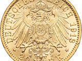 a close up of a gold coin with an eagle on it
