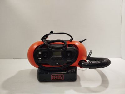 an orange blow dryer sitting on top of a white table