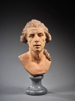 une image représentant le buste d'un homme aux cheveux longs