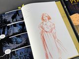 a book with a drawing of a woman in a dress