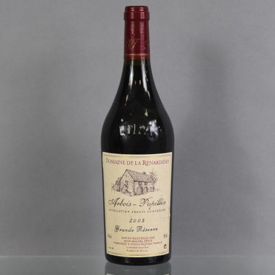 a bottle of wine that is sitting on a table