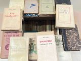 a lot of books that are sitting on top of a table