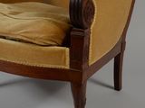 an image of a chair with a pillow on it and a pillow on the back of the chair